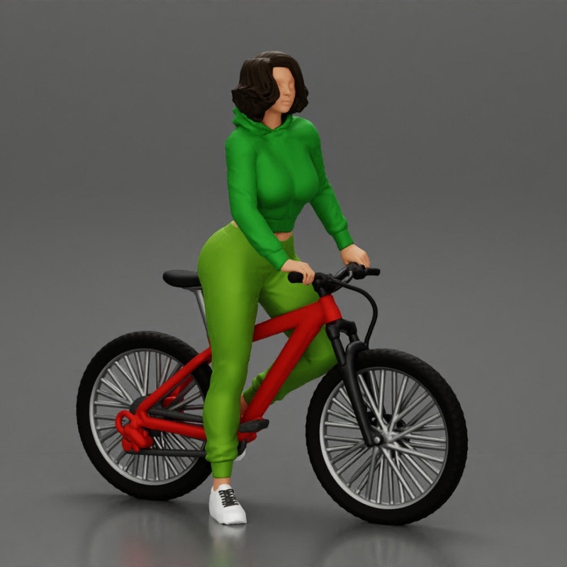 Young sexy sporty woman in pants and snickers short haired posing with bicycle