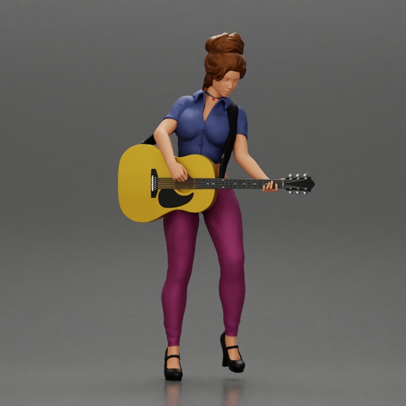 Young woman with short hair standing playing on an acoustic guitar on stage