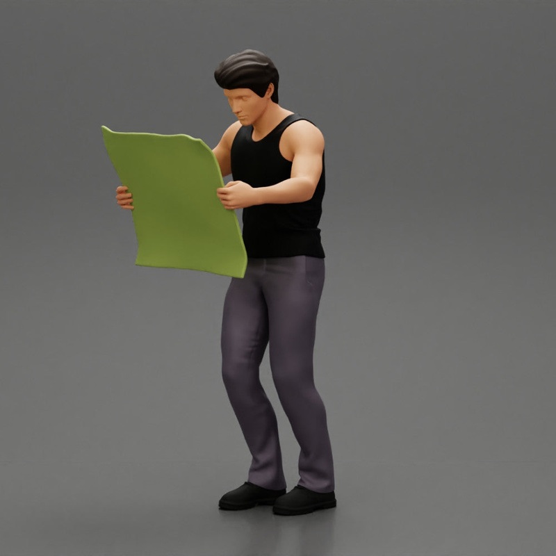Young Man Holding Map And Looking At It While Standing On The City