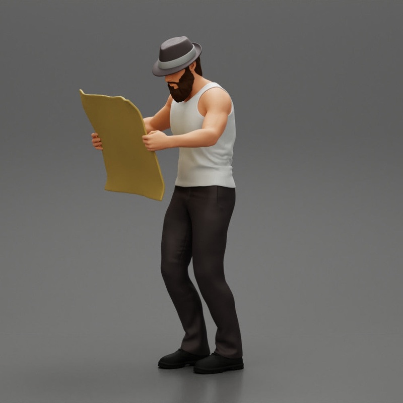 Young Man in hat with beard Holding Map And Looking At it
