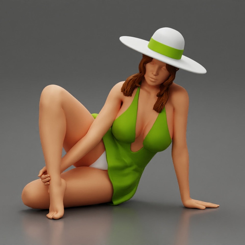 young woman in a summer suit and hat sitting